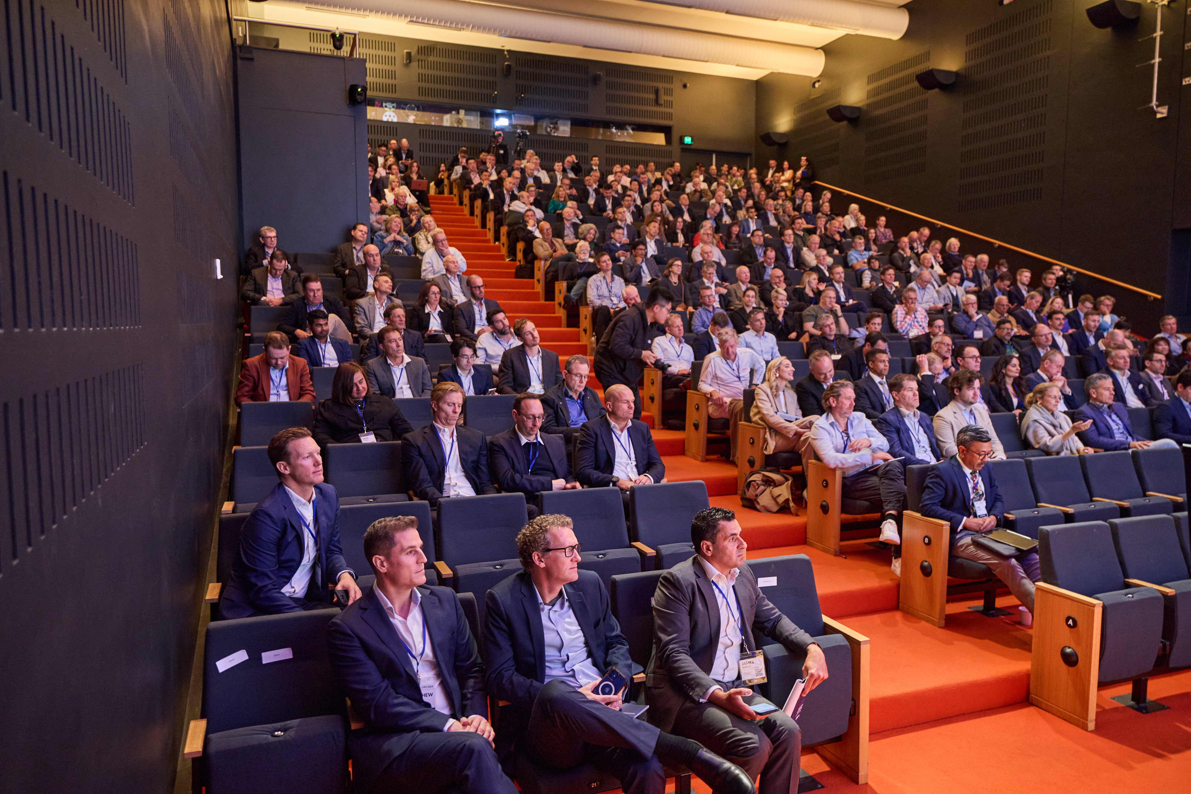 A highly engaged audience listens to the insights of the AI Pie panel at Livewire Live 2024.