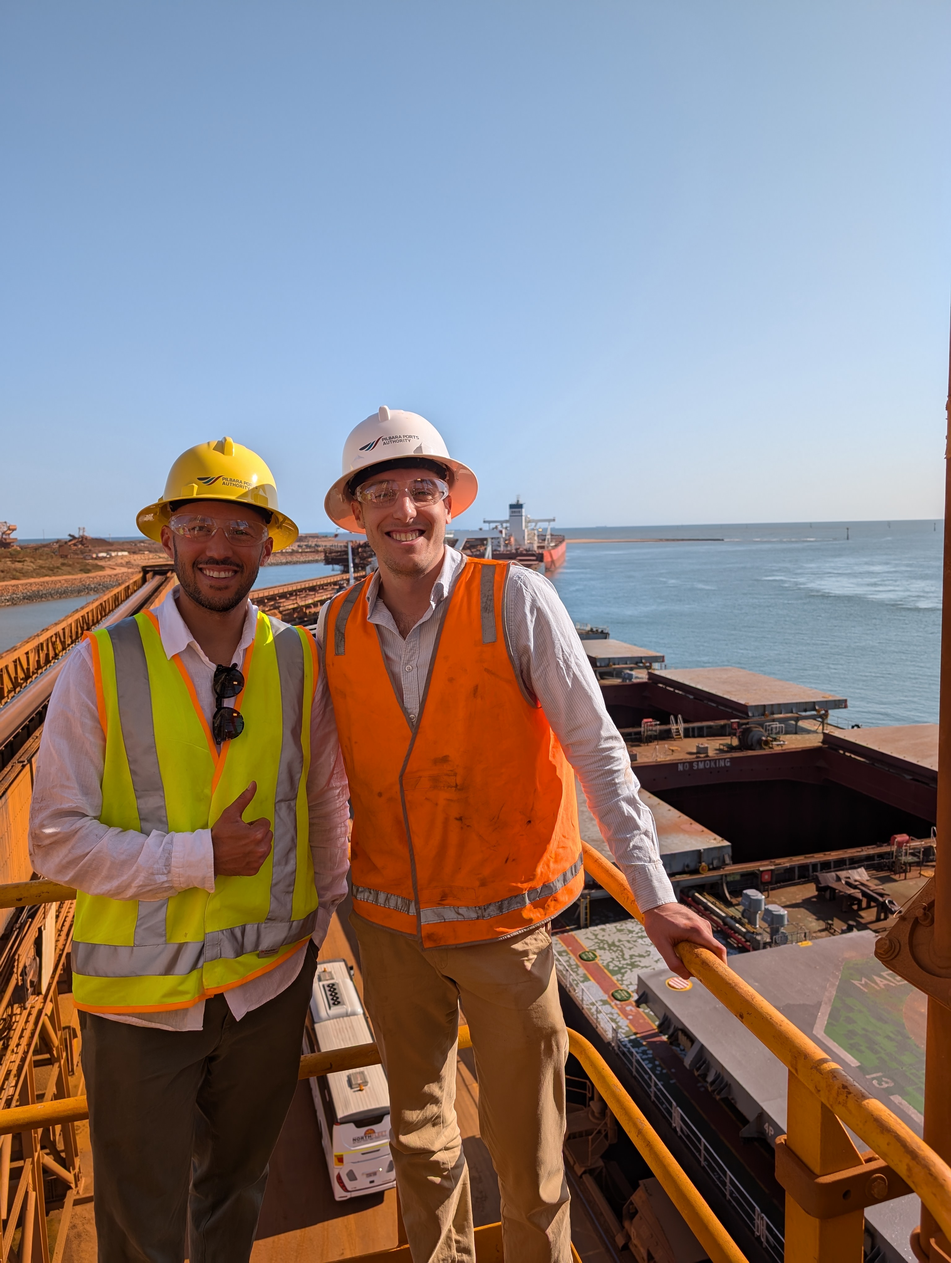 Port Hedland: Luke and Ben atop a ship loader (left), ship docked (middle), and ship loader dumping iron ore into ships headed to China (right). Source: Seneca photos from Wildcat site visit