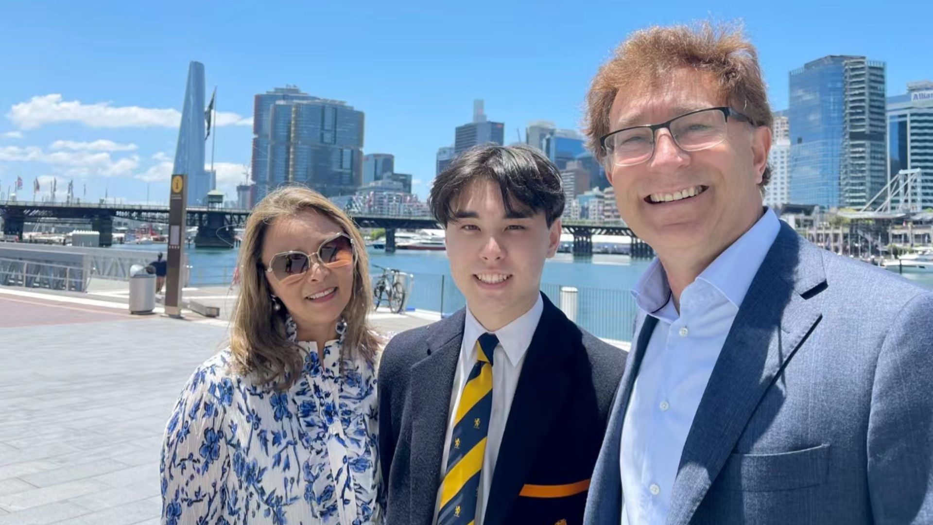 Andy with his parents after his high school graduation. 