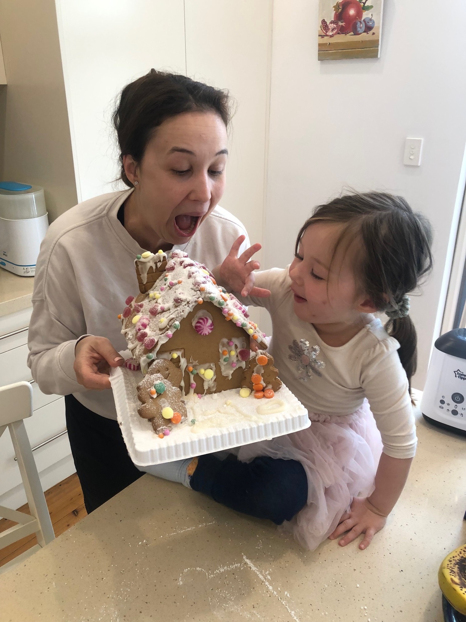 Diana baking with her daughter. 